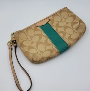 GUC Coach Wristlet Tan with a teal colored stripe down the middle